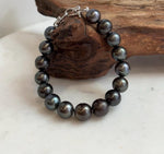 Tahitian pearl bracelet featuring green and silvery hues.