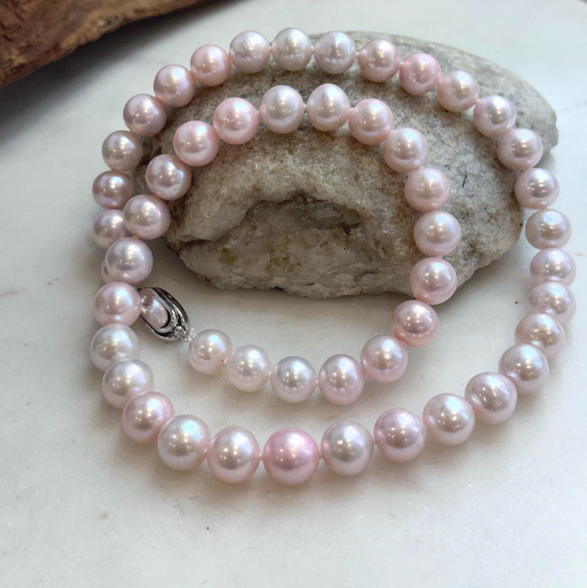 Hand-knotted freshwater pearl necklace in delicate pale pink.