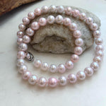 Hand-knotted freshwater pearl necklace in delicate pale pink.