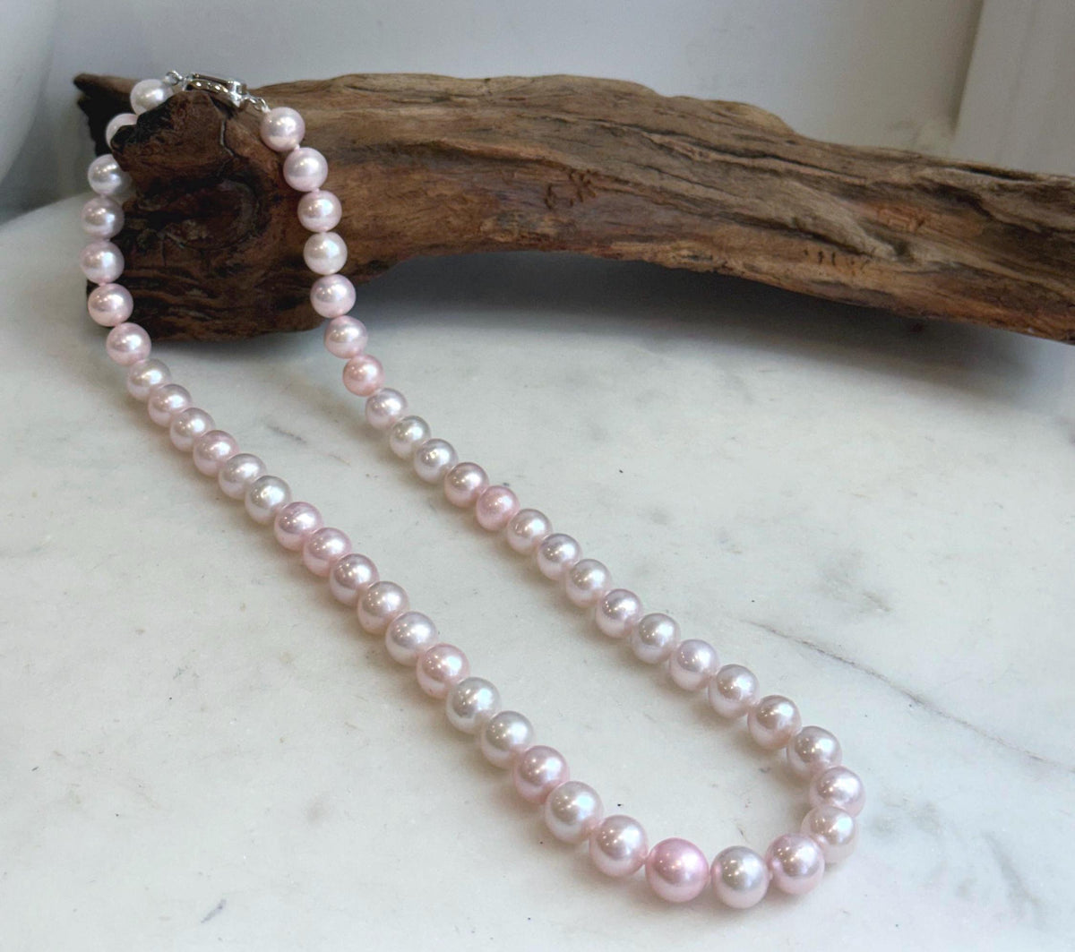 Soft pink pearl strand with S925 silver fastening.