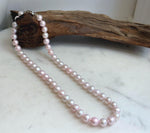 Soft pink pearl strand with S925 silver fastening.
