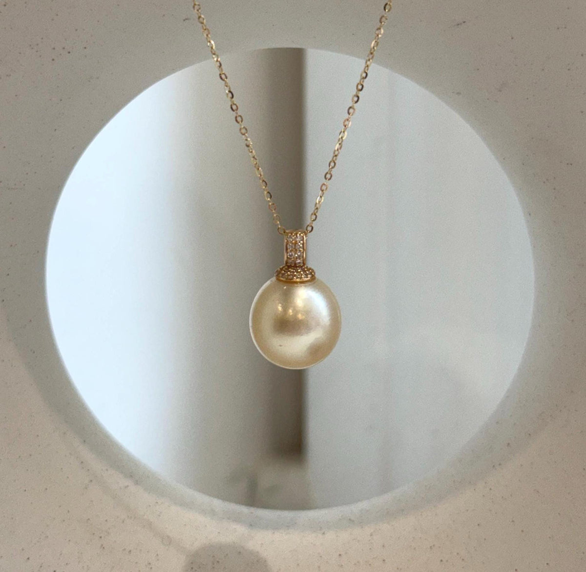 Lustrous champagne gold saltwater pearl in S925 silver.