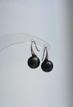 S925 sterling silver drop earrings featuring round black-green pearls.