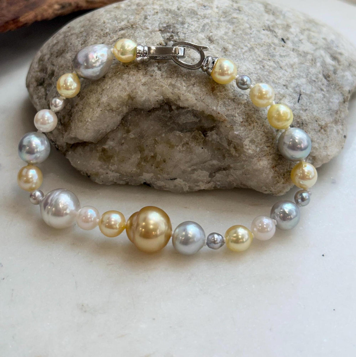 Hand-knotted ocean pearl bracelet featuring a mix of pearl colors and sizes.
