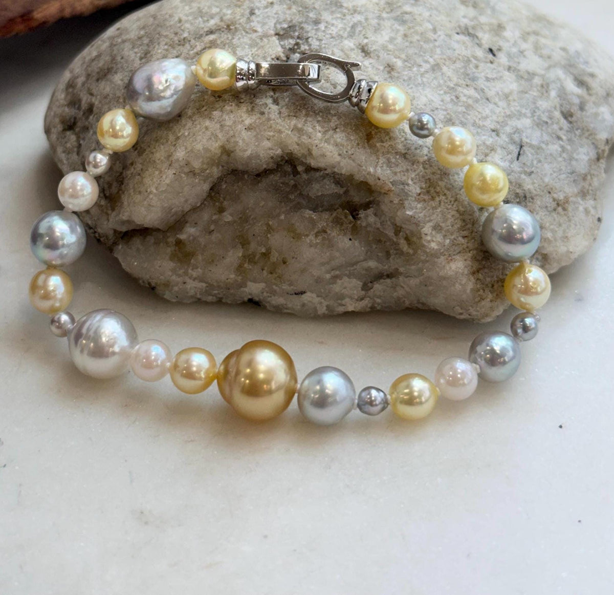 Hand-knotted strand of 24 multicolor ocean pearls with an S925 silver closure.