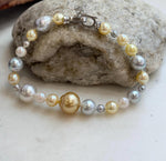 Hand-knotted strand of 24 multicolor ocean pearls with an S925 silver closure.