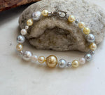Elly’s multicolor saltwater pearl bracelet with hand-knotted construction and sterling silver fastening.