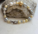 Genuine ocean pearls in assorted colors form a bracelet with an S925 silver clasp.