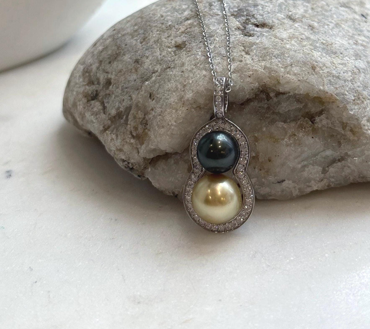 South Sea and Tahitian saltwater pearls paired in a gourd-shaped pendant.