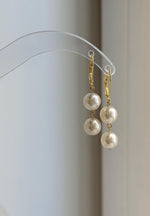 Gold-plated silver leverback earrings with softly reflective ivory Akoya pearls.