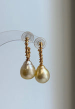 Golden pearl drop earrings featuring S925 sterling silver hooks.