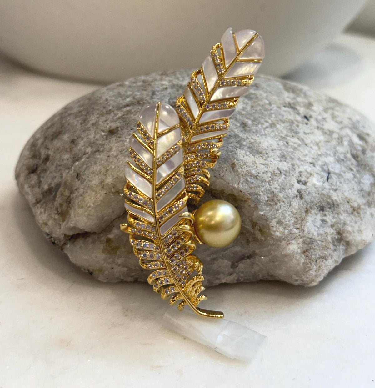 Golden South Sea pearl brooch pendant with two curved feather motifs