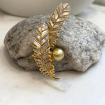 Two-in-one South Sea pearl brooch and pendant with feather details
