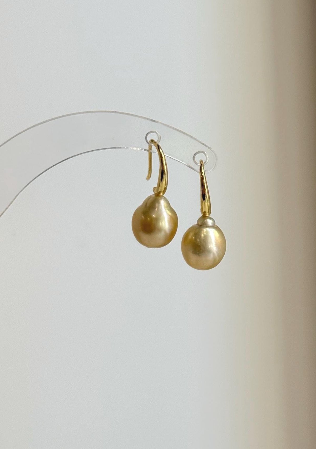 South Sea pearl drop earrings with warm champagne gold tones.