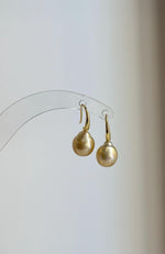 Gold-tone S925 silver hooks paired with lustrous golden South Sea pearls.