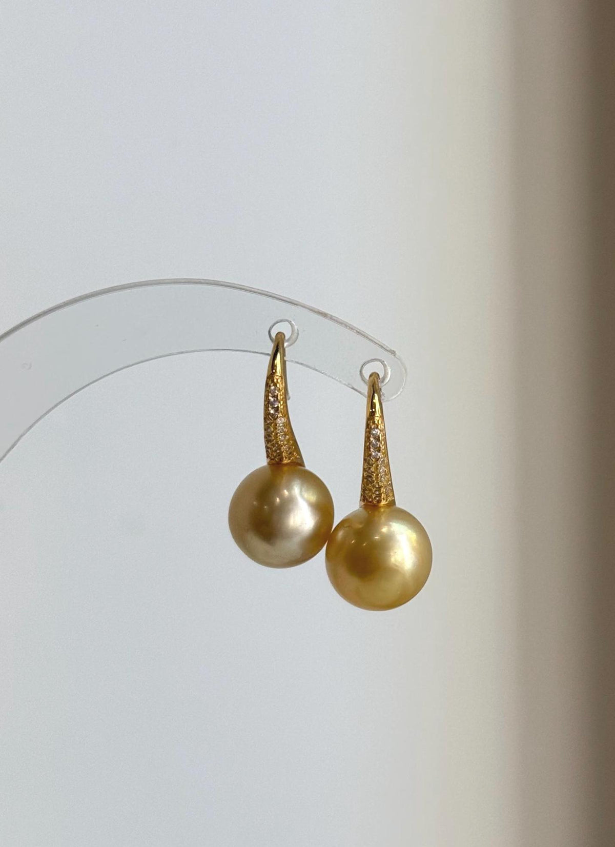 Deep tea golden pearl drop earrings with sculptural S925 silver settings.