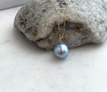 Genuine saltwater South Sea pearl in silver blue tones, set in 18K solid gold with moissanite.