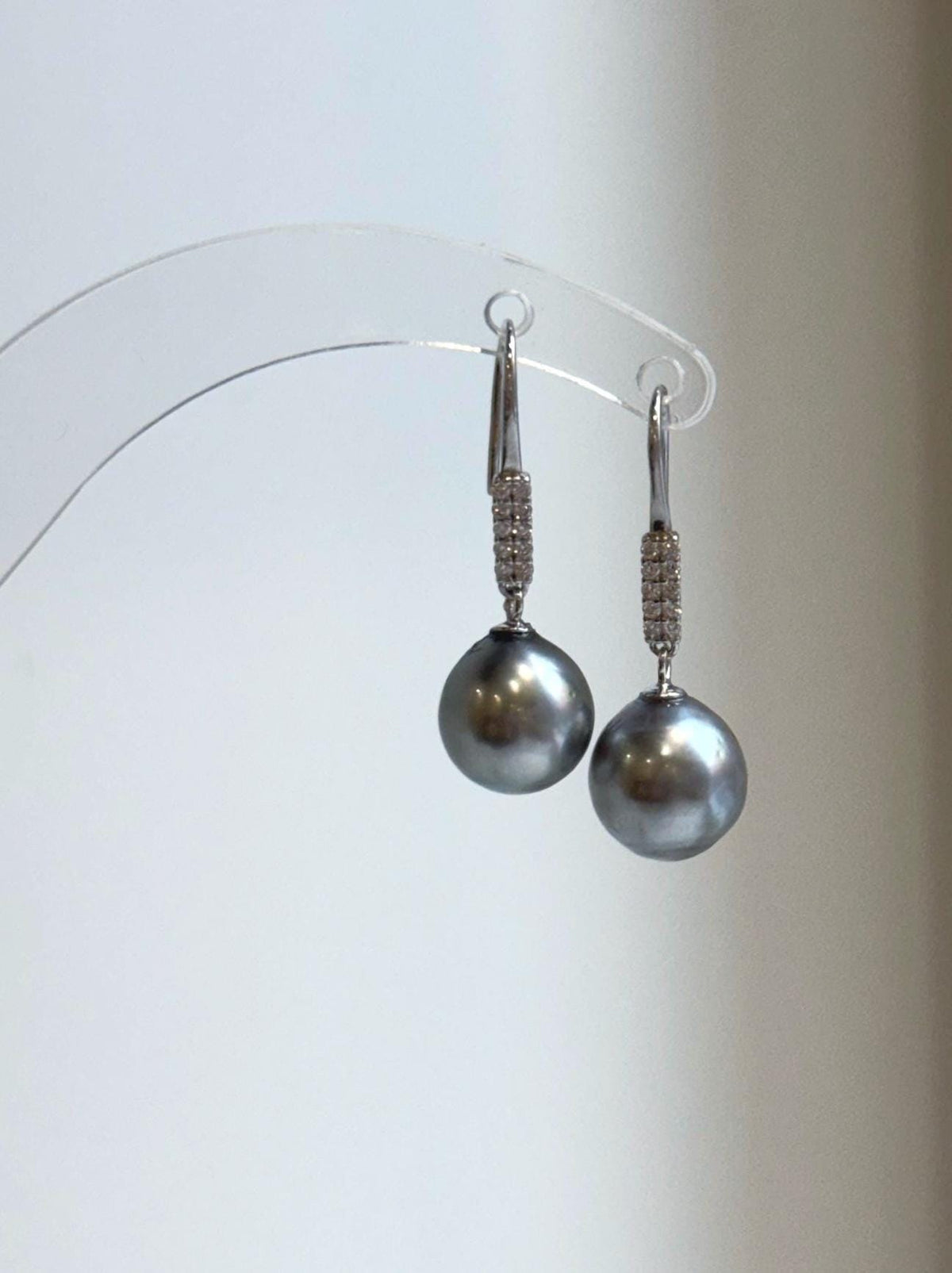 Round gray pearls suspended from sterling silver hooks