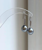 Platinum gray pearl earrings with reflective luster