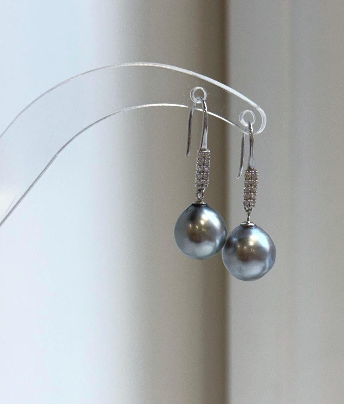 Platinum gray pearl earrings with reflective luster
