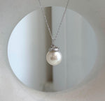 Elly’s Australian white ocean pearl pendant with an acorn design and extreme luster.