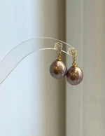 Rose mauve freshwater pearls set in S925 sterling silver earrings.