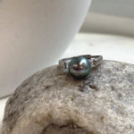 Vintage adjustable sterling silver ring with a peacock green Tahitian pearl.