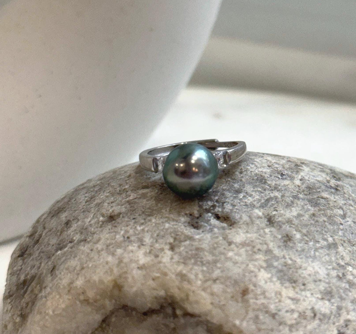 Peacock green Tahitian pearl paired with a vintage silver ring setting.