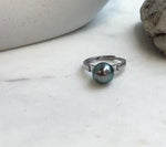 Peacock green pearl centerpiece on an adjustable sterling silver band.