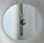 Platinum gray Tahitian pearl pendant with crystal accents and S925 sterling silver setting.