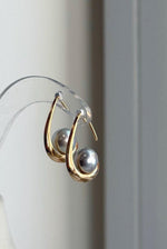 Akoya pearl hook earrings with delicate silver blue tones and mirror-like shine.