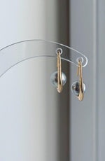 S925 sterling silver hook earrings featuring genuine silver blue saltwater pearls.