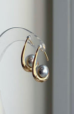 Genuine Akoya pearl drop earrings with silver blue coloring and reflective surfaces.