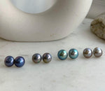 Iridescent round Mabe pearl earrings in minimalist S925 sterling silver settings.