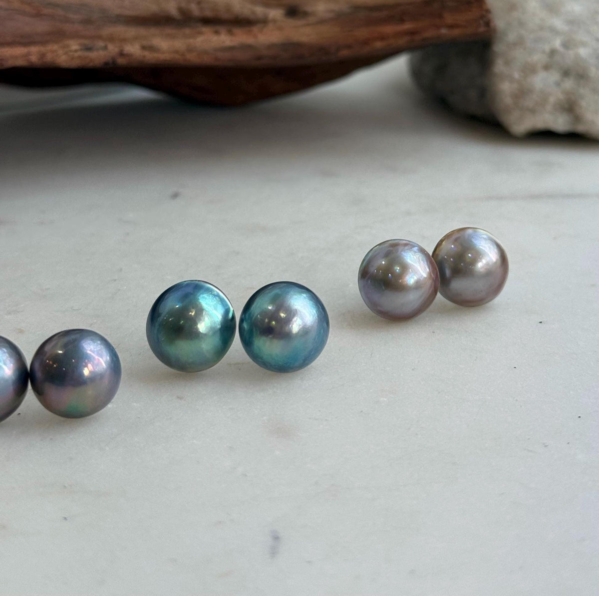 S925 sterling silver settings framing round saltwater Mabe pearls.