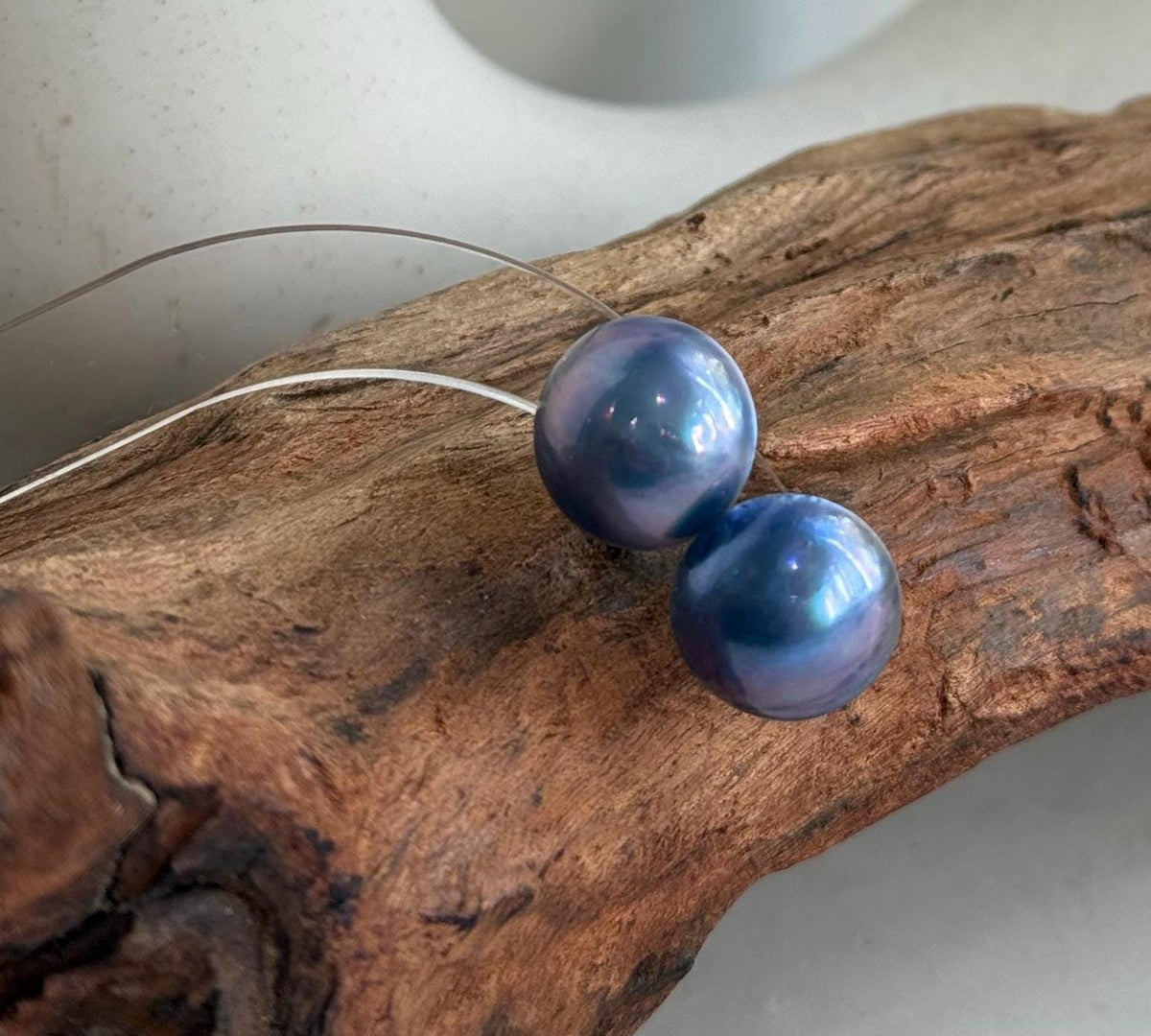 Lustrous Mabe pearl earrings with a simple sterling silver design.