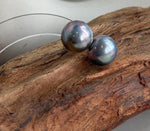 Genuine iridescent Mabe pearls paired with minimalist silver earring settings.