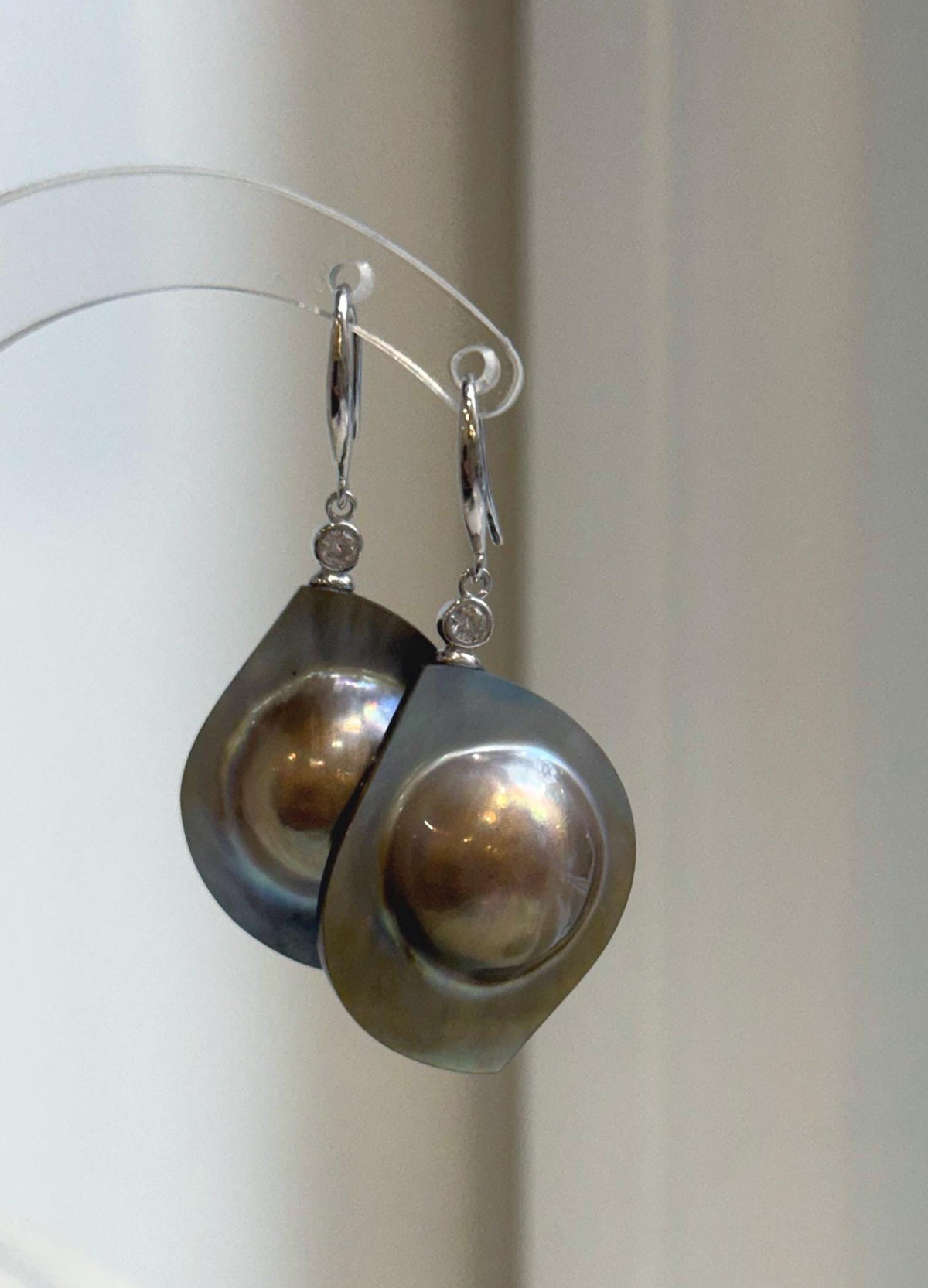 Rainbow golden mabe pearls with a luminous, reflective surface.