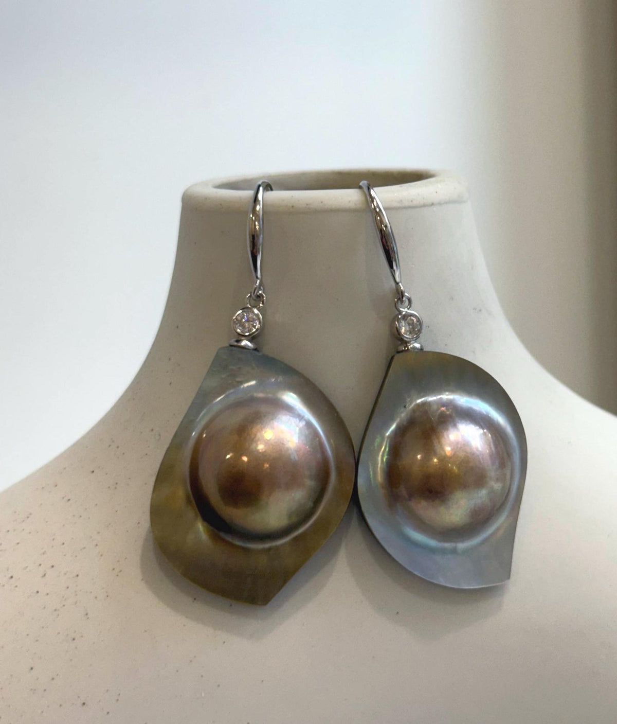S925 sterling silver drop earrings featuring golden mabe pearls.