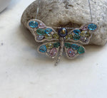 Butterfly brooch that can also be worn as a pearl pendant.