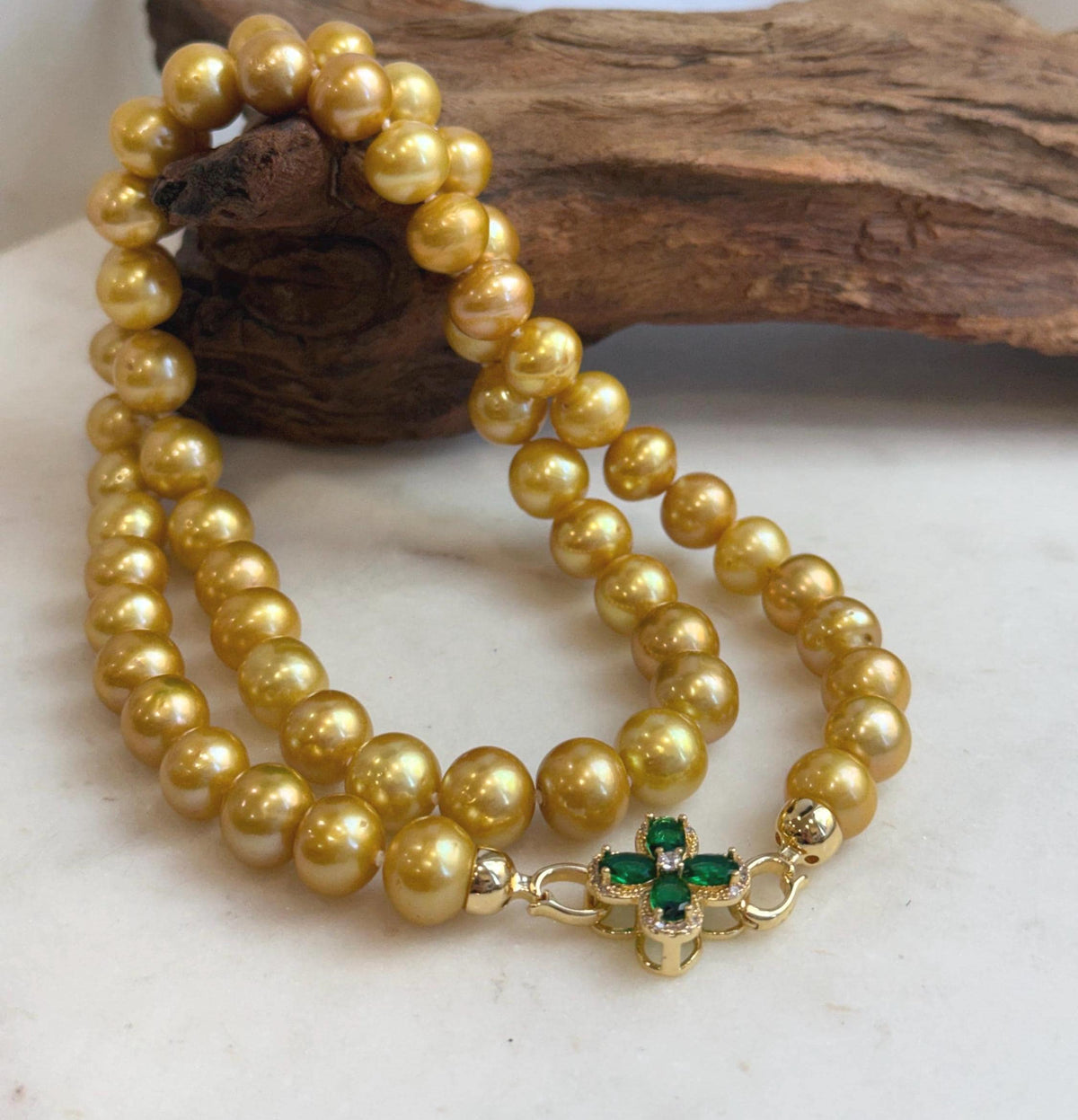 Genuine Edison pearl necklace in warm golden tones.