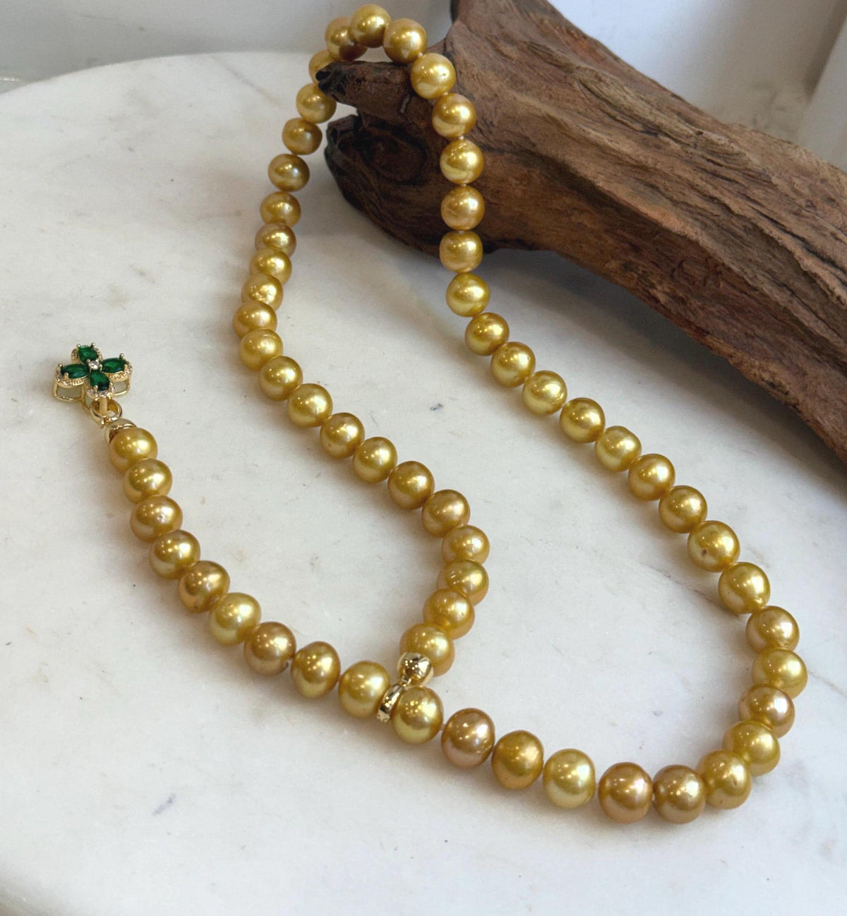 Long golden Edison pearl necklace with mirror-like shine.