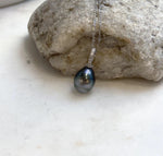Tahitian pearl necklace featuring hunter green and silver tones with mirror luster.