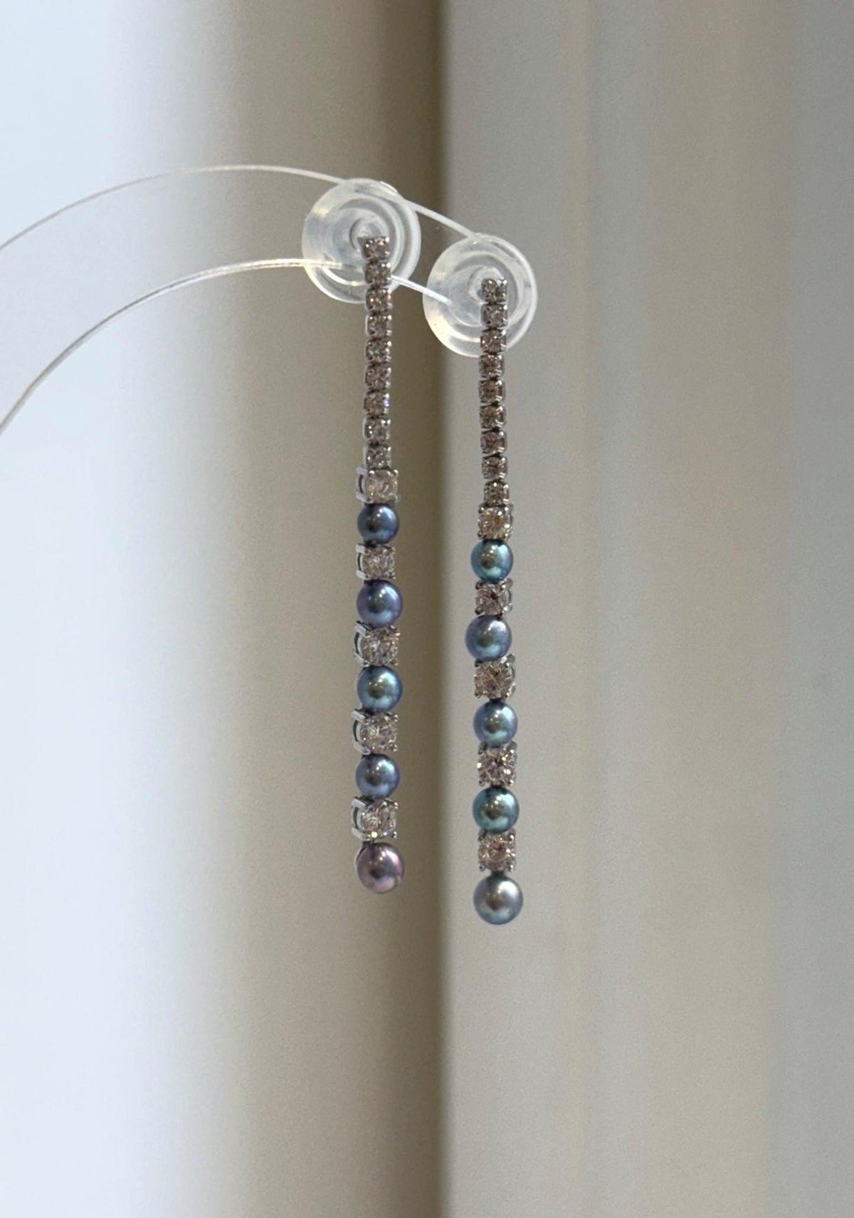 Peacock freshwater pearl drop earrings with sparkling crystal accents.