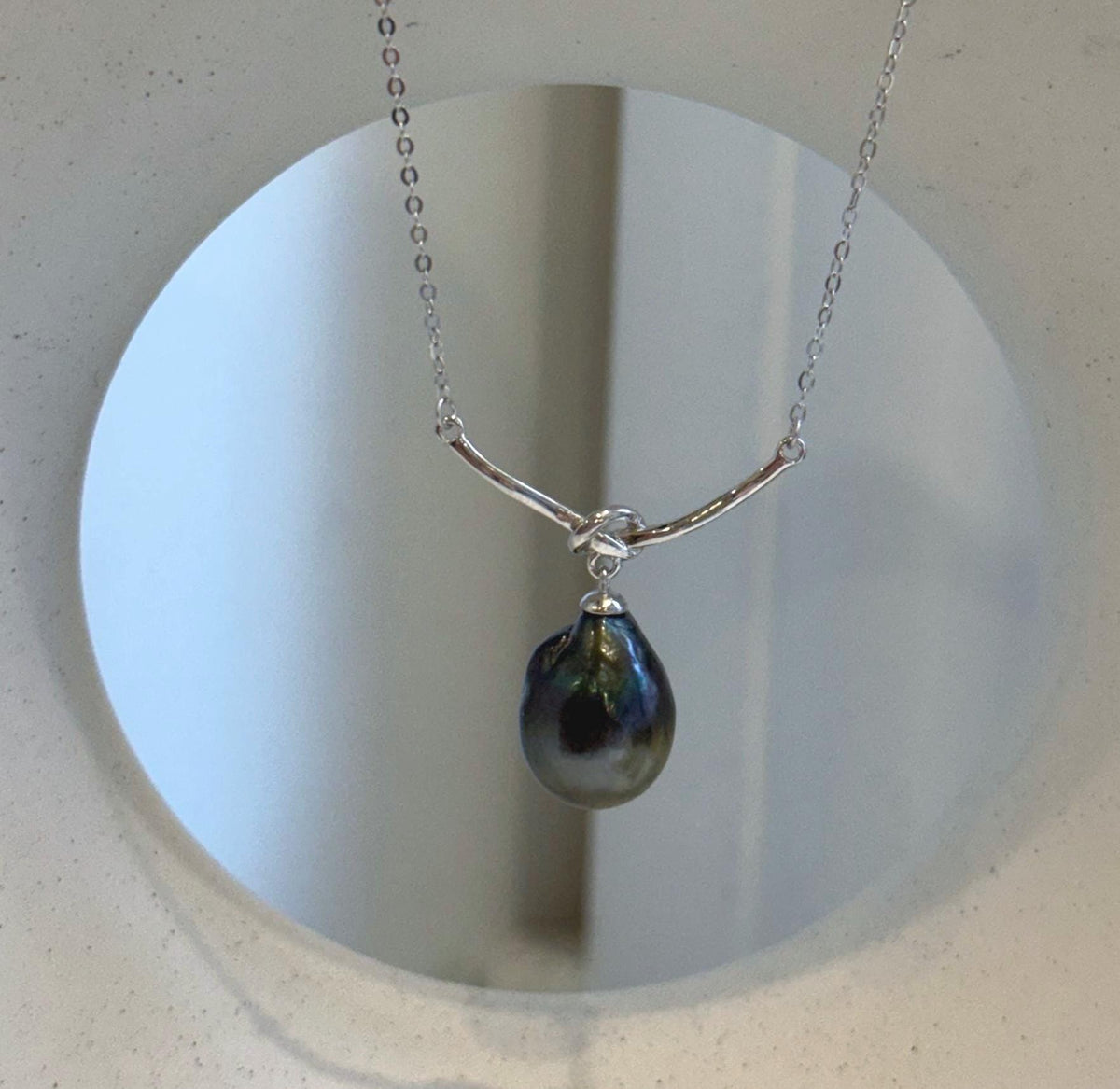 Iridescent hunter green Tahitian pearl paired with a delicate S925 sterling silver chain.