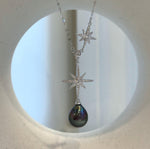 Peacock Tahitian pearl Y necklace with two sparkling starburst accents and an S925 sterling silver chain.