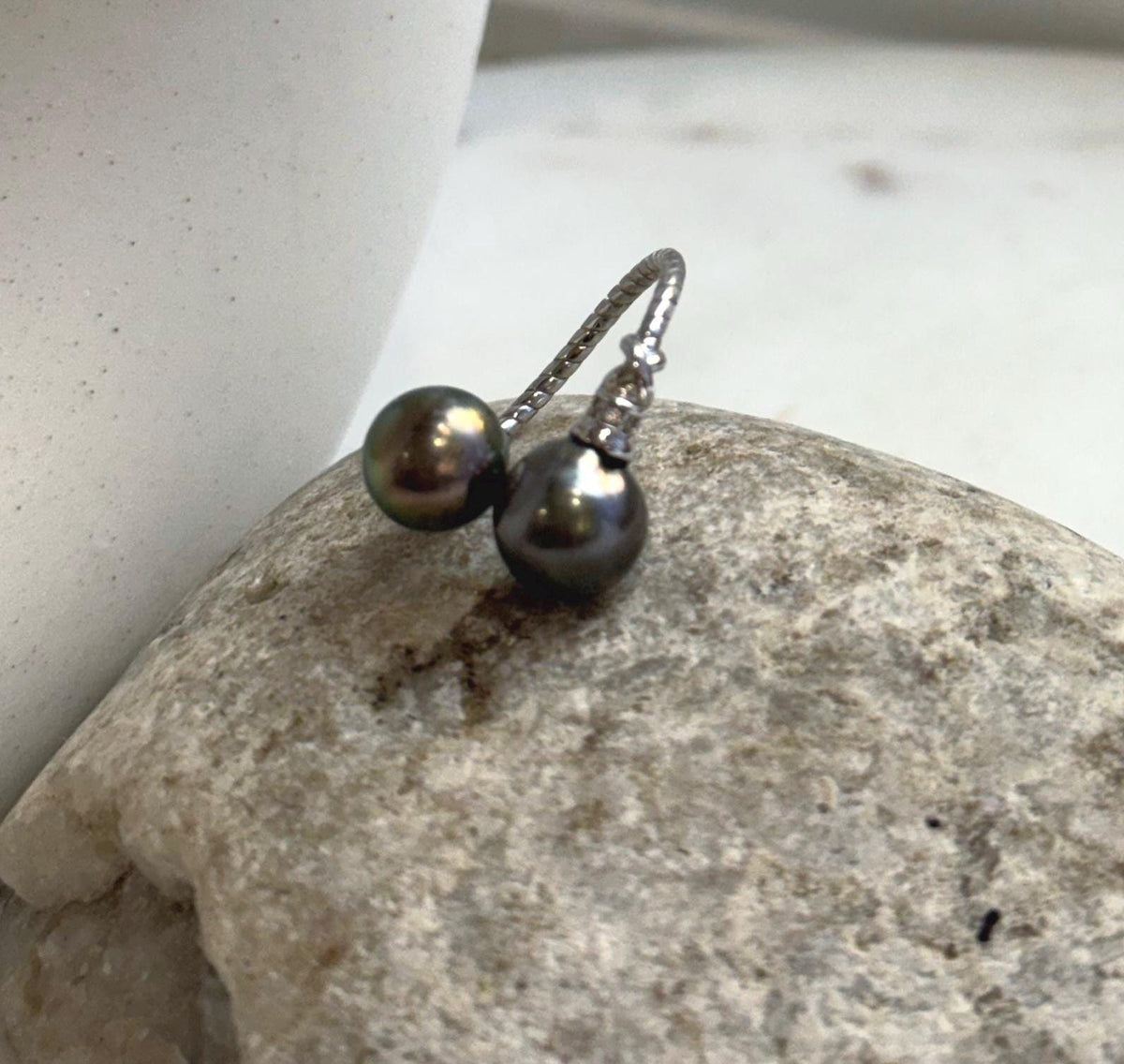Tahitian pearl duo with mirror-like reflections in a minimalist silver setting.