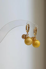 Golden South Sea and freshwater pearl drop earrings.
