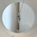 Peacock pearl pendant with a delicate silver leaf design