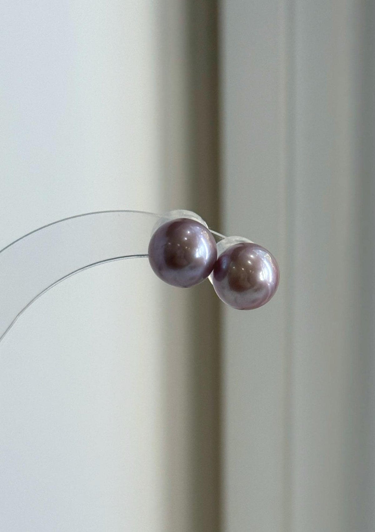 Rose lavender pearl studs shown with sterling silver posts.